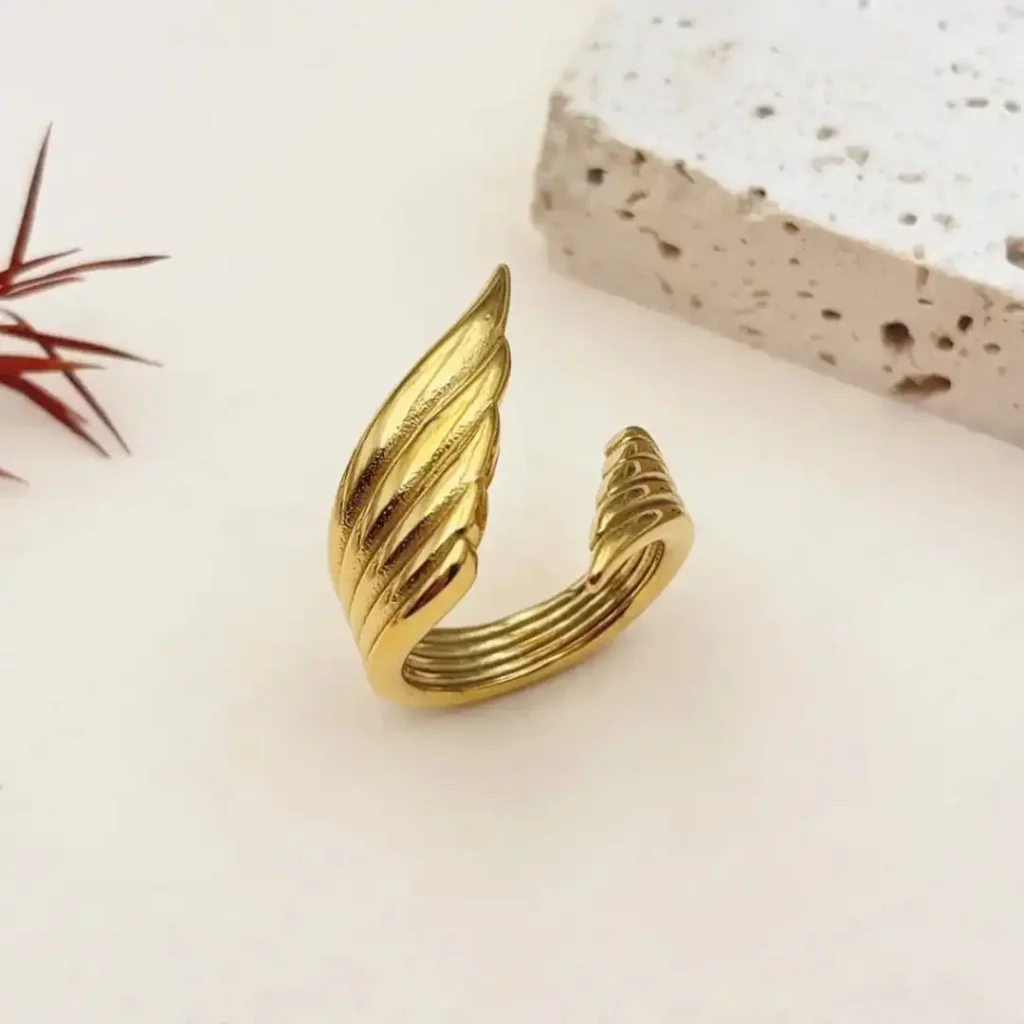 caption. Stylish Gold Plated Open Ring Design for Women on Finger